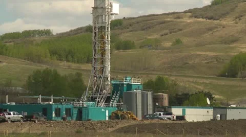 Oil industry, oil rig prairies tight shot Stock Footage
