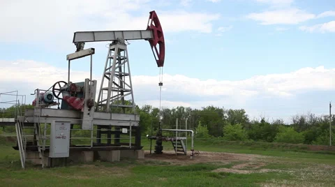 Oil Industry Pumpjack in the Field  Stock Footage 63136285