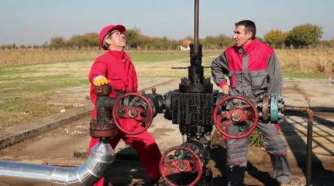 Oil industry Workers Discussing Issues at Work Stock Footage 26904754
