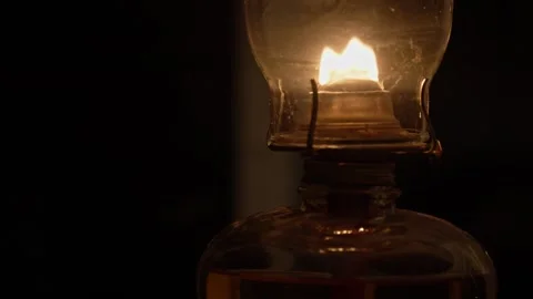 Oil lamp lantern flame light glass in dark room Stock Footage 259229620