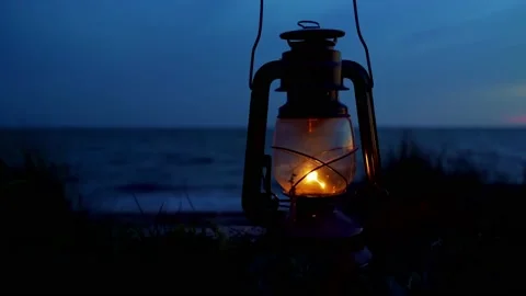 Oil lantern on a beach at night Stock Footage 141714260