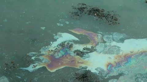Oil Leak on Water Creating Pollution Stock Footage