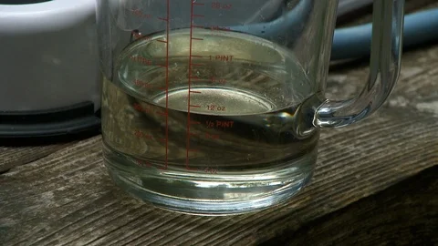 Oil In Measuring Cup Stock Footage 115860240