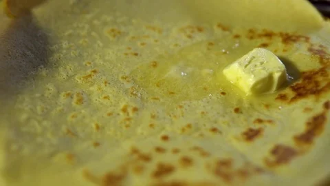 The oil melts on a hot pancake. Stock Footage 84610081