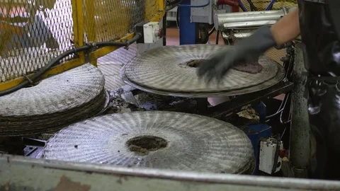 Oil mill worker preparing the oil press Stock-Footage 82322936