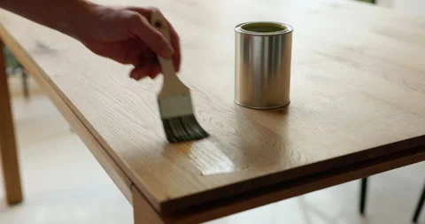 Oil oak table with brush Stock Footage 248696045