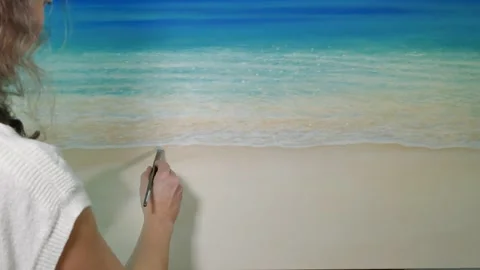 Oil painter makes scene of seashore, checks color pallette Stock Footage 313956595