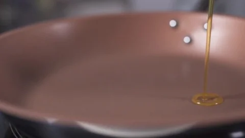 Oil into the pan Stock Footage 127124661