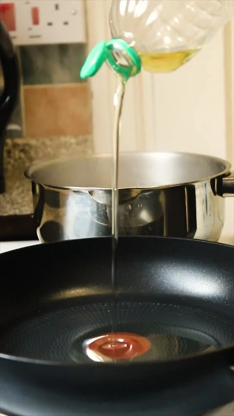 OIL ON A PAN Stock Footage 303724536