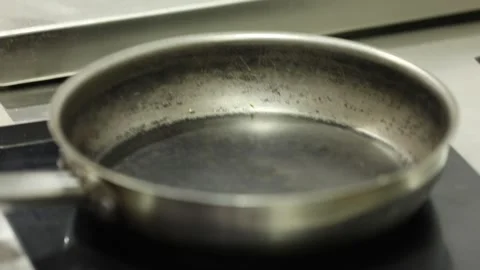 Oil in a pan on the stove 1 Stock Footage 314974112