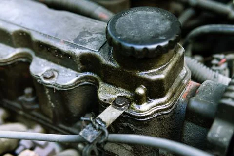 Oil plug on an internal combustion engine. Changing the oil in the car. Dirty Stock Photos