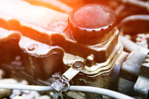 Oil plug on an internal combustion engine. Changing the oil in the car. Dirty Stock Photos