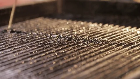 Oil is poured on the grill Stock Footage 75246007