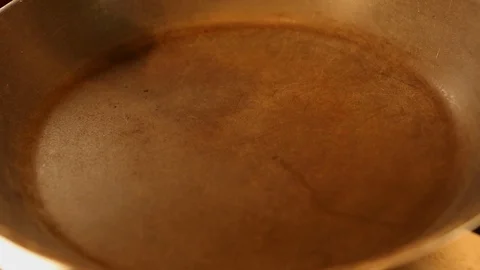 Oil is poured into the pan Stock Footage 91305404
