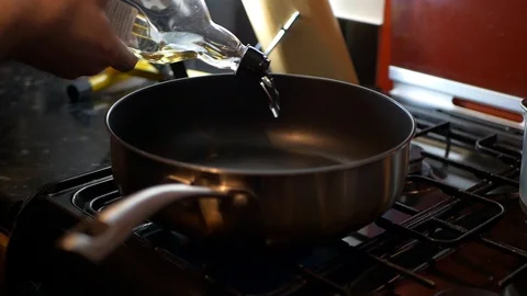 Oil poured into pan Stock-Footage 102410175