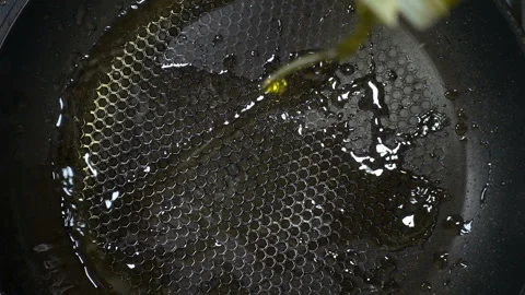 Oil is poured in slow motion. Stock Footage 148103136