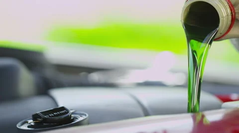 Oil pouring into an engine in slow motion Stock-Footage 49241086