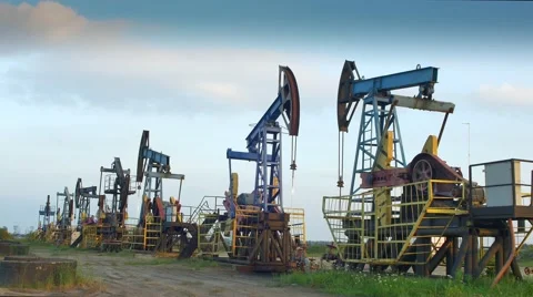 Oil Producing Rigs in Perspective Stock Footage 68943154