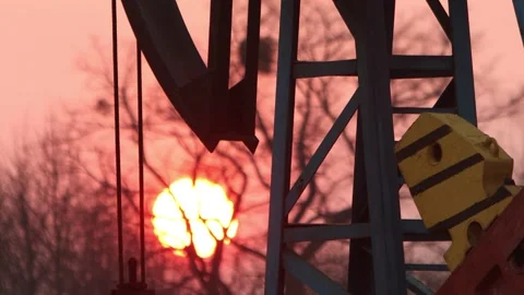 Oil production against the backdrop of the setting sun Stock Footage 172470877