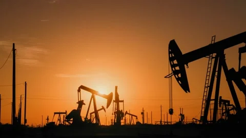 Oil production plants at sunset Stock Footage