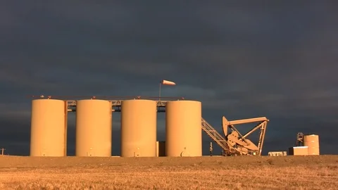 Oil Production Well gold light wide Stock Footage