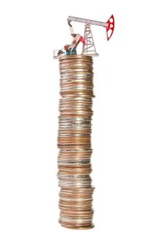 Oil pump and stack of coins isolated on white background. The concept of oil  Foto stock