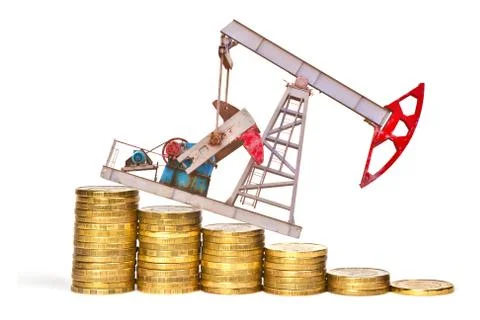 Oil pump and stack of coins isolated on white background. The concept of oil  写真素材