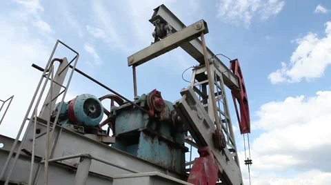 Oil pump on a background of the cloudy sky Video stock 63136930