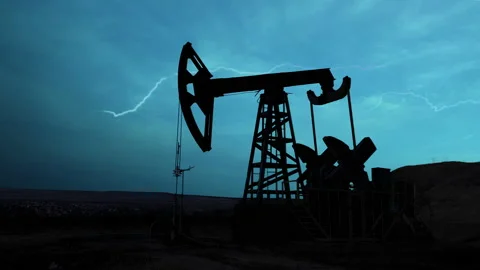 Oil pump on the background of the night sky with bright lightning. Stock Footage