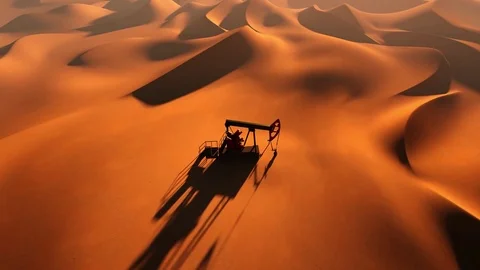 Oil pump between sand dunes Stock Footage 83658069