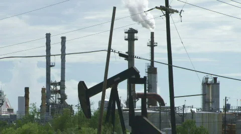 Oil Pump, Electric Lines, and Smoke Stacks Stock Footage