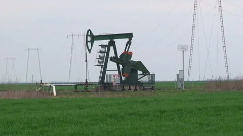 Oil pump in a field Stock Footage 64016563