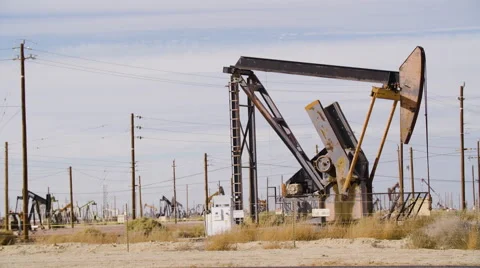 Oil Pump Field Medium shot by the highway Stock Footage 68768560