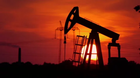 Oil pump in the field with sunset in the back 動画素材 41702975