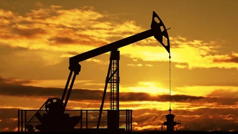 Oil pump jack against sunset Stock Footage 87610619