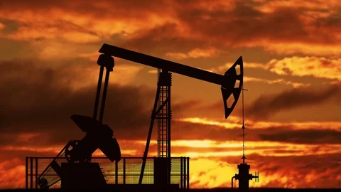 Oil pump jack against sunset Stock Footage 87612237