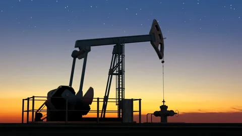 Oil pump jack extracting crude oil under starry sunset sky Video stock 127016147