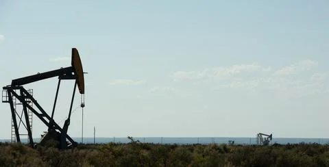 Oil pump jack Stock Photos