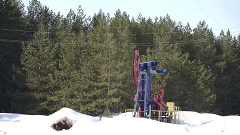 Oil pump jack pumping crude oil for fossil fuel energy Stock Footage 85390765