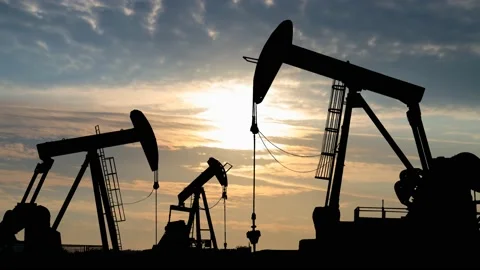 Oil pump Jack Silhouette, Time Lapse at Sunrise Stock Footage 150727185