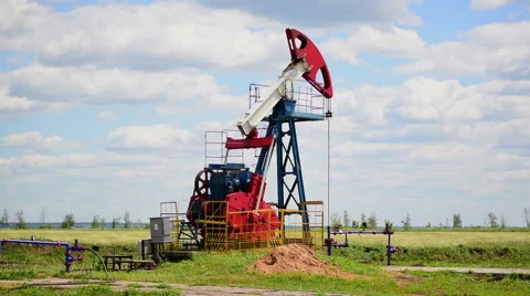 Oil pump in a rye field Stock Footage 64114003