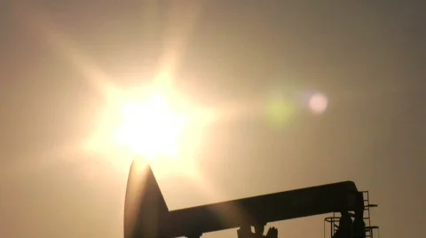 Oil Pump silhouette, eclipses sun Stock Footage 354697