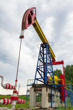 The oil pump on a sky background Stock Photos