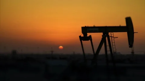 Oil Pump Timelapse at Sunset - Defocused background Stock Footage 87671830