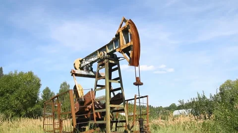 Oil pump working on the blue sky Stock Footage 62889254