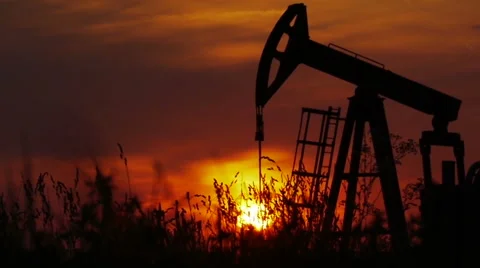 Oil pump working in the field, sunset-slow motion 動画素材 41698010