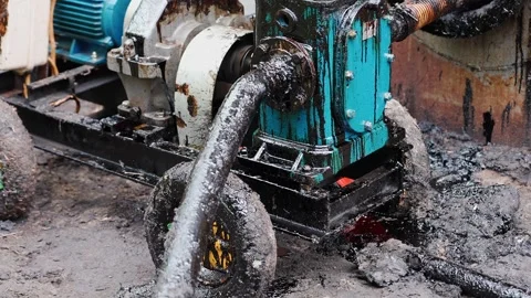 Oil pumping machine working and vibrating pumping oil from tank. Oil flows 스톡 동영상 286340616