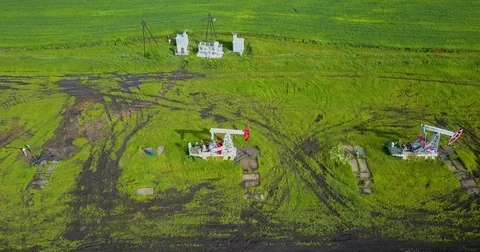 Oil pumping stations in operation aerial view Stock Footage 77486357