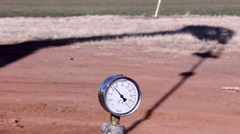 Oil pumping unit shadow with gauge Stock Footage 41381803