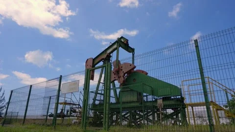 Oil pumpjack (nodding donkey)  in work. Oil industry in Seria, Brunei. Stock Footage 132188319